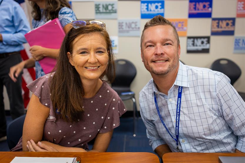 A PTO president sits next to the Edmondson Elementary principal